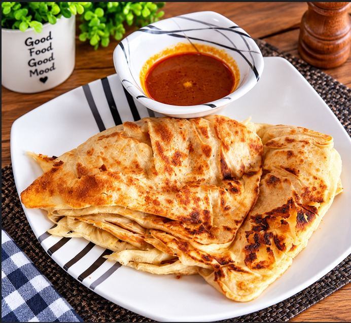 Roti canai served with curry
